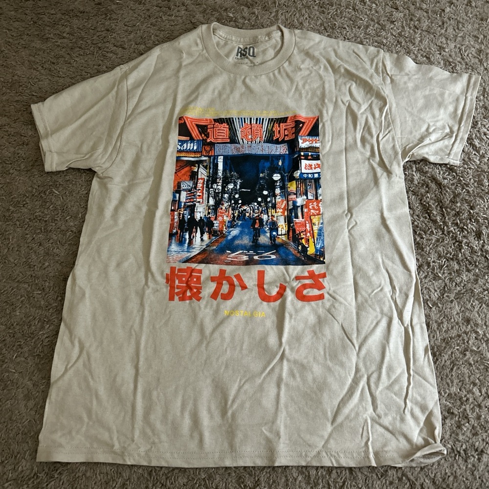 RSQ Beige Graphic Tee with Red and Blue Accents